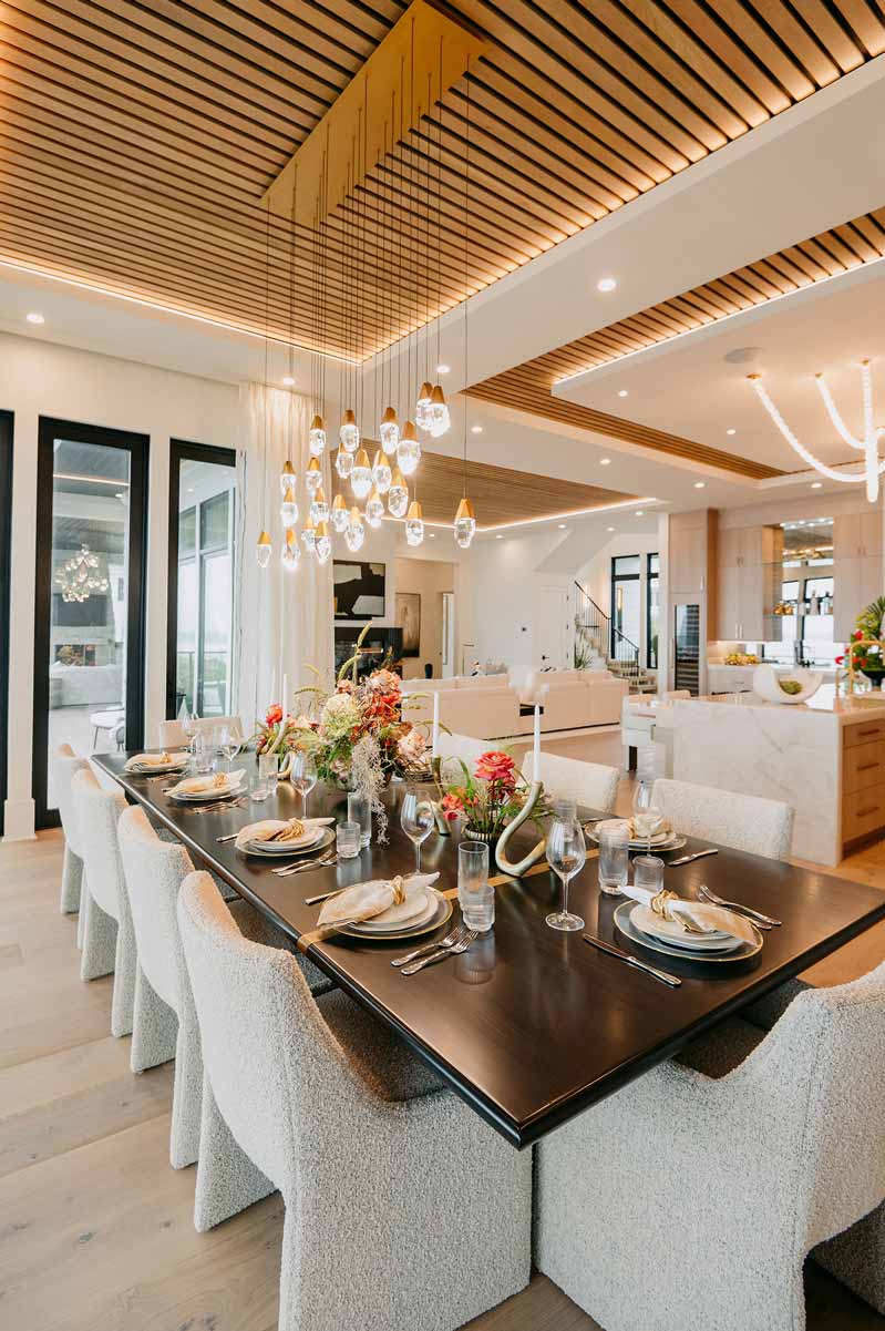 A natural wood slatted ceiling complements this gorgeous beach house dining area.